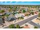 Bird's-eye view of a neighborhood showcasing well-maintained homes with desert landscaping and palm trees at 10836 N 108Th N Pl, Scottsdale, AZ 85259