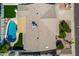 Aerial shot of a home's roof, pool area, and well-kept yard showcasing outdoor amenities at 10836 N 108Th N Pl, Scottsdale, AZ 85259