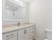 Bright bathroom with single sink, marble counters and backsplash and white cabinets at 10836 N 108Th N Pl, Scottsdale, AZ 85259