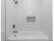 Bright bathroom bathtub with subway tile backsplash and stainless steel fixtures at 10836 N 108Th N Pl, Scottsdale, AZ 85259