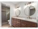 This bathroom features a double sink vanity, gold accents, and a walk-in shower at 10836 N 108Th N Pl, Scottsdale, AZ 85259