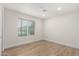 Bright bedroom with hardwood floors, recessed lighting, and large window at 10836 N 108Th N Pl, Scottsdale, AZ 85259