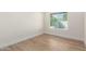 Bright bedroom with hardwood floors and a window that lets in lots of natural light at 10836 N 108Th N Pl, Scottsdale, AZ 85259