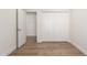 Bright bedroom with hardwood floors and a door opening at 10836 N 108Th N Pl, Scottsdale, AZ 85259