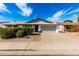 Charming single-story home featuring a two-car garage, manicured landscaping and a well-maintained lawn at 10836 N 108Th N Pl, Scottsdale, AZ 85259