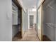 Hallway with mirrored closets leads to bathroom, offering ample storage and accessibility at 10836 N 108Th N Pl, Scottsdale, AZ 85259