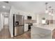 Well-appointed kitchen features stainless steel appliances, modern cabinetry, and a spacious island for meal preparation at 10836 N 108Th N Pl, Scottsdale, AZ 85259