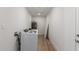 Well-equipped laundry room with washer, dryer, water heater, and bright lighting at 10836 N 108Th N Pl, Scottsdale, AZ 85259