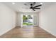 Spacious living room with wood floors and glass doors opening to backyard with pool at 10836 N 108Th N Pl, Scottsdale, AZ 85259