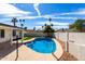 Backyard oasis showcasing a sparkling pool, mature trees, and a tranquil setting for relaxation at 10836 N 108Th N Pl, Scottsdale, AZ 85259