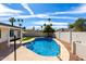 Inviting pool area features shimmering water, easy access, and beautiful palm trees, perfect for relaxation and outdoor enjoyment at 10836 N 108Th N Pl, Scottsdale, AZ 85259