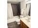 Well-lit bathroom features a shower-tub, stylish vanity, and modern fixtures at 12222 N Paradise Village S Pkwy # 409, Phoenix, AZ 85032