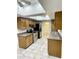 Bright kitchen with stainless steel appliances, warm wood cabinetry, and an open layout at 12222 N Paradise Village S Pkwy # 409, Phoenix, AZ 85032