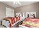 Bedroom featuring two beds and a closet at 12526 S 176Th Ave, Goodyear, AZ 85338