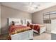 Bedroom with two beds and ceiling fan at 12526 S 176Th Ave, Goodyear, AZ 85338