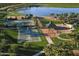 Community park offering tennis and basketball courts, green space, and shaded picnic areas by the lake at 12526 S 176Th Ave, Goodyear, AZ 85338