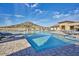 Resort-style pool with plenty of lounge chairs surrounded by landscaping and community buildings at 12526 S 176Th Ave, Goodyear, AZ 85338