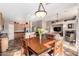 Open-concept space with a dining area connecting the kitchen and living room at 12526 S 176Th Ave, Goodyear, AZ 85338