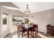 Bright dining area with a table for four and a view of the outdoor patio at 12526 S 176Th Ave, Goodyear, AZ 85338
