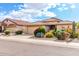 Beautiful single-Gathering home with a tile roof, a two-car garage, and mature desert landscaping at 12526 S 176Th Ave, Goodyear, AZ 85338