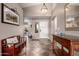 Bright foyer with neutral walls, tile flooring, a charming bench, and decorative console table at 12526 S 176Th Ave, Goodyear, AZ 85338