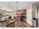 Functional kitchen featuring stainless steel appliances and a convenient breakfast bar at 12526 S 176Th Ave, Goodyear, AZ 85338