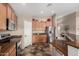 Well-lit kitchen with stainless steel appliances and ample counter space at 12526 S 176Th Ave, Goodyear, AZ 85338