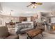 Open-concept living room and kitchen with stainless steel appliances and comfortable seating at 12526 S 176Th Ave, Goodyear, AZ 85338