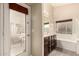Ensuite bathroom features a soaking tub, double vanity, and a private door to the outdoor space at 1289 E Baker Dr, San Tan Valley, AZ 85140