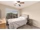 Bedroom with neutral walls, ceiling fan, and window for natural light at 1289 E Baker Dr, San Tan Valley, AZ 85140