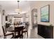 Spacious dining area with table and chairs, open to the living room at 1289 E Baker Dr, San Tan Valley, AZ 85140