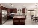 Modern kitchen with stainless steel appliances and central island with seating at 1289 E Baker Dr, San Tan Valley, AZ 85140
