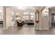 Open-concept living room featuring archways, wood floors and lots of natural light at 1289 E Baker Dr, San Tan Valley, AZ 85140