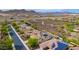 An aerial shot showcasing a neighborhood with solar panels and a community walking path through the desert at 13336 W Via Caballo Blanco --, Peoria, AZ 85383