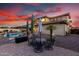 Expansive backyard with patio, pool, and beautiful sunset views at 13336 W Via Caballo Blanco --, Peoria, AZ 85383