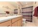 Bathroom features a single sink vanity and a shower-tub combo at 13336 W Via Caballo Blanco --, Peoria, AZ 85383