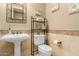 Charming powder bathroom features a pedestal sink and decorative wall decor at 13336 W Via Caballo Blanco --, Peoria, AZ 85383