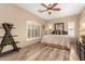 Bright bedroom showcasing a queen bed, neutral colors, and plantation shutters at 13336 W Via Caballo Blanco --, Peoria, AZ 85383