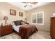 Comfortable bedroom with a queen-sized bed, wood-look flooring, and natural light from the window at 13336 W Via Caballo Blanco --, Peoria, AZ 85383