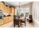 Bright breakfast nook features plantation shutters and a view of the pool at 13336 W Via Caballo Blanco --, Peoria, AZ 85383