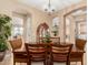 Charming dining room showcasing a wood table, stylish chairs, and elegant details at 13336 W Via Caballo Blanco --, Peoria, AZ 85383