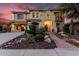 Inviting two-story home with desert landscaping and a brick walkway leading to the front entrance at 13336 W Via Caballo Blanco --, Peoria, AZ 85383