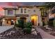 Inviting two-story home with desert landscaping and a brick walkway leading to the front entrance at 13336 W Via Caballo Blanco --, Peoria, AZ 85383