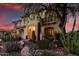 Inviting two-story home with desert landscaping and a brick walkway leading to the front entrance at 13336 W Via Caballo Blanco --, Peoria, AZ 85383