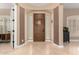 Inviting foyer featuring neutral-toned walls, tile flooring, and a solid wood front door with sidelights at 13336 W Via Caballo Blanco --, Peoria, AZ 85383