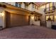Beautiful home featuring a two-car garage, an ornate metal gate, and a brick driveway at 13336 W Via Caballo Blanco --, Peoria, AZ 85383