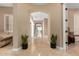 Spacious hallway with neutral walls, tile flooring, and a view of the backyard through the glass patio doors at 13336 W Via Caballo Blanco --, Peoria, AZ 85383