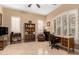 Spacious home office with shuttered windows, a bookcase, and a comfortable chair at 13336 W Via Caballo Blanco --, Peoria, AZ 85383