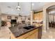 Bright kitchen features granite countertops, a modern island and opens to the living room at 13336 W Via Caballo Blanco --, Peoria, AZ 85383
