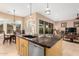 Bright kitchen features granite countertops, a modern island, and stainless steel appliances at 13336 W Via Caballo Blanco --, Peoria, AZ 85383